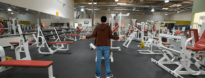 Man standing in empty gym